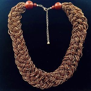 Antique brass-colored braided resin beaded statement necklace